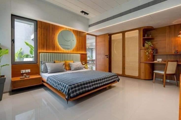 Modern Bedroom with Wood Panel Accents and Built-In Workspace