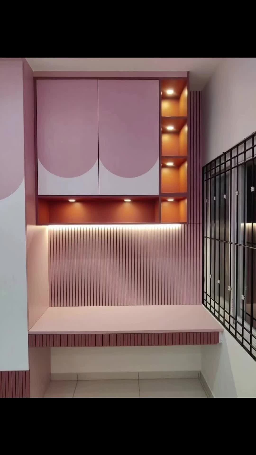 Modern Pink Cabinetry with Lighting Accents