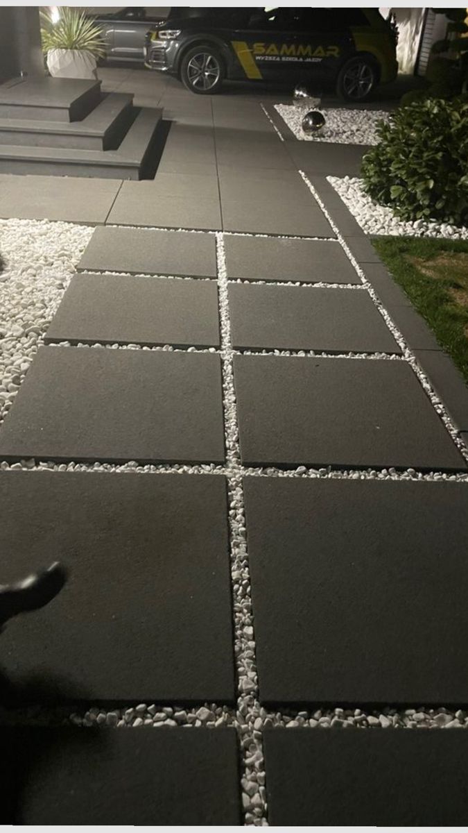 Modern minimalist walkway with large concrete pavers