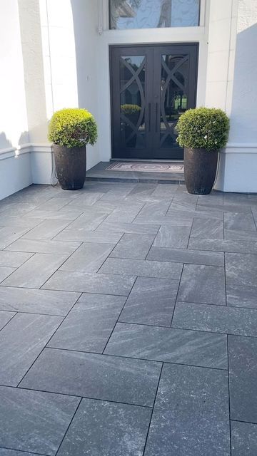 Modern Stone Entryway with Geometric Tile Pattern