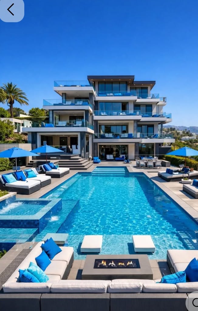 Modern Luxury Home with Expansive Pool and Outdoor Lounge Area