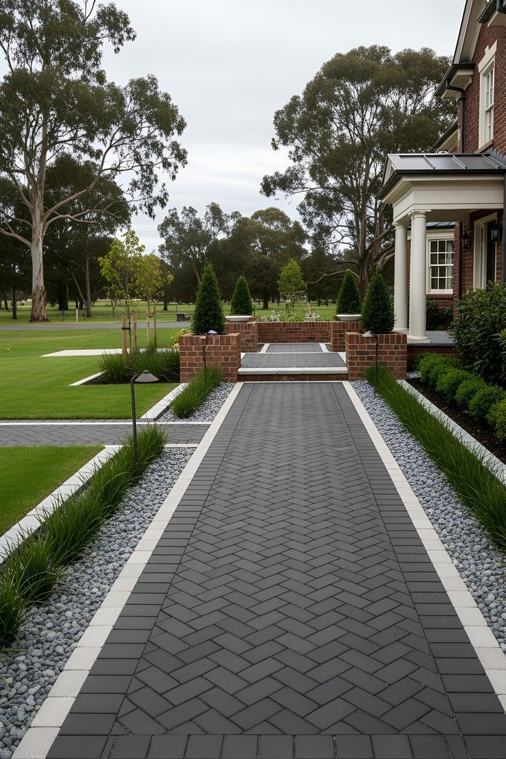 Herringbone Paver Walkway with Brick Entry and Modern Landscaping