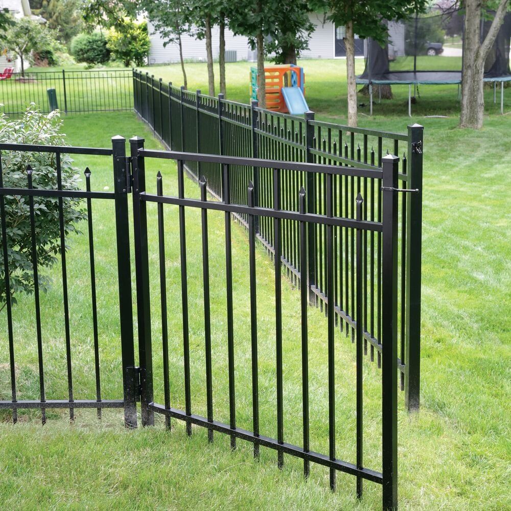 Black Metal Fence with Gate in a Family-Friendly Backyard Setting