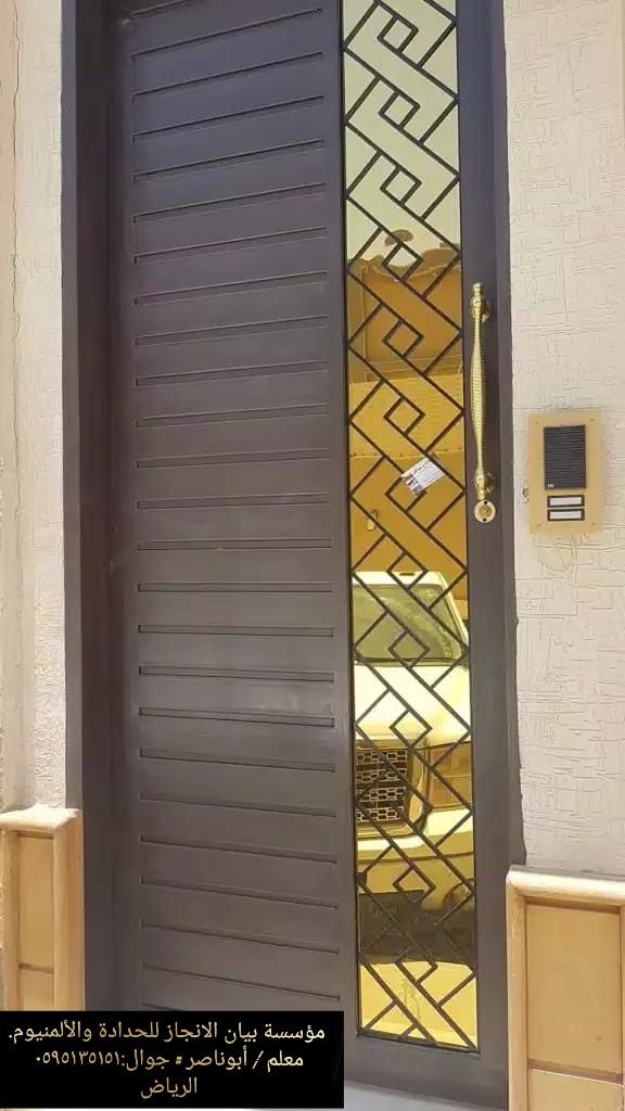 Modern Steel Entry Door with Geometric Glass Panel and Gold Handle