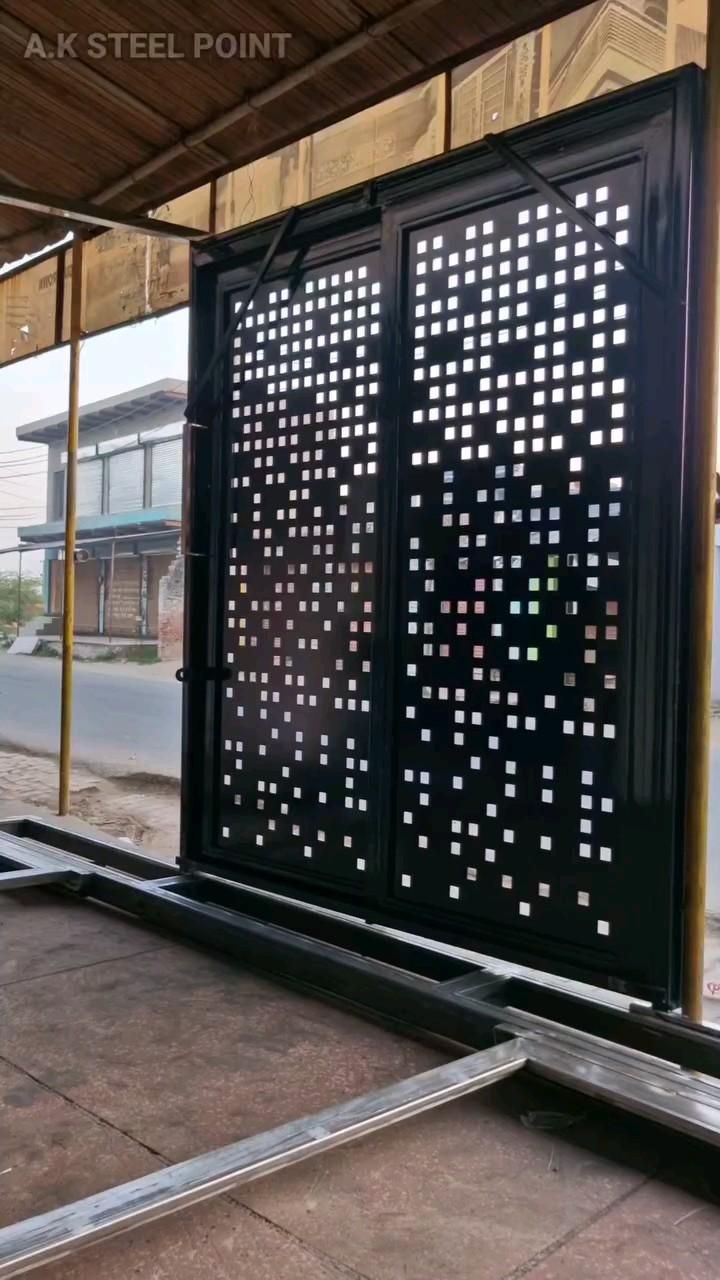 Modern Black Steel Gate With Geometric Cutout Pattern for Exteriors